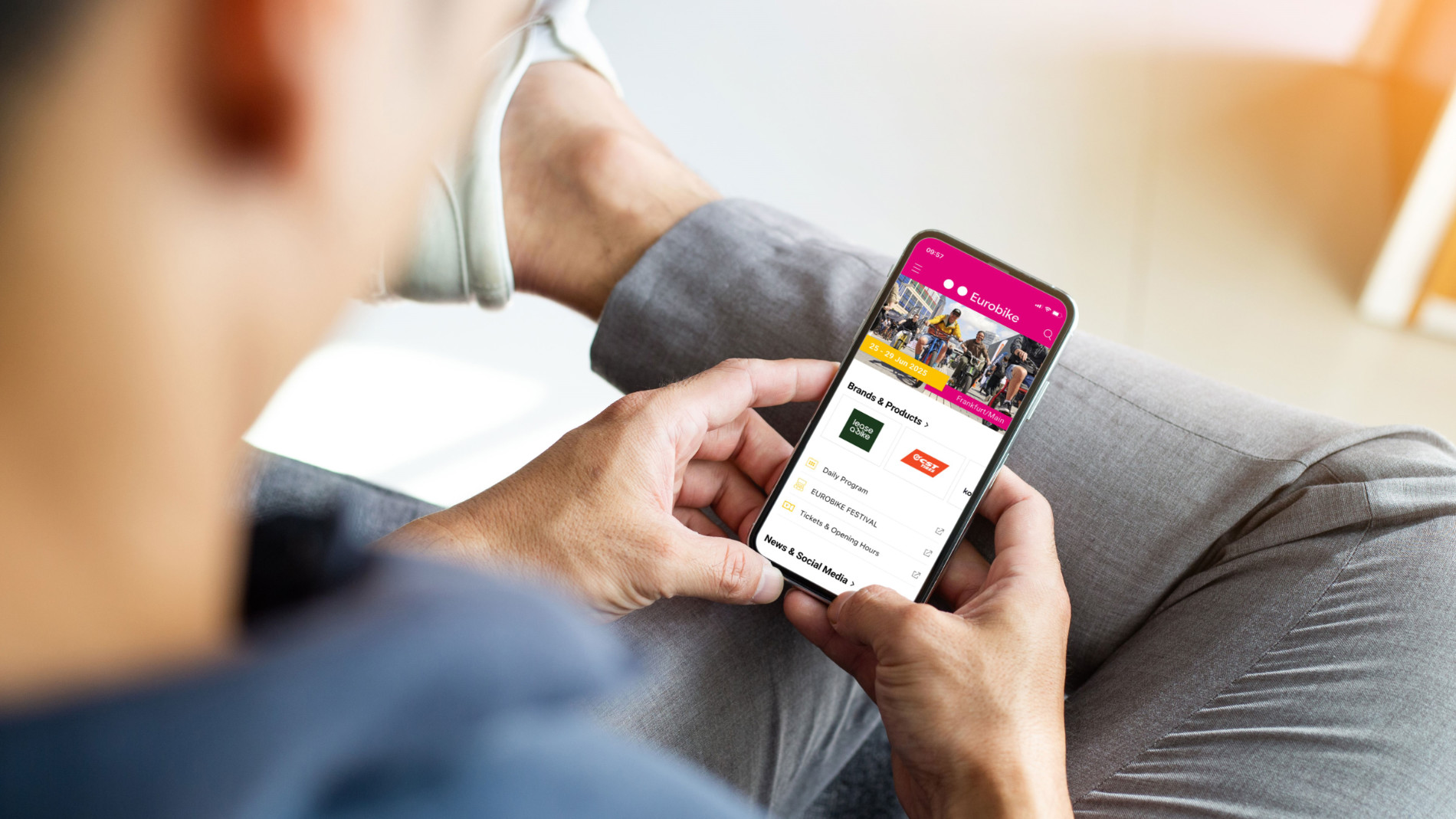 Visitor using trade fair app on smartphone