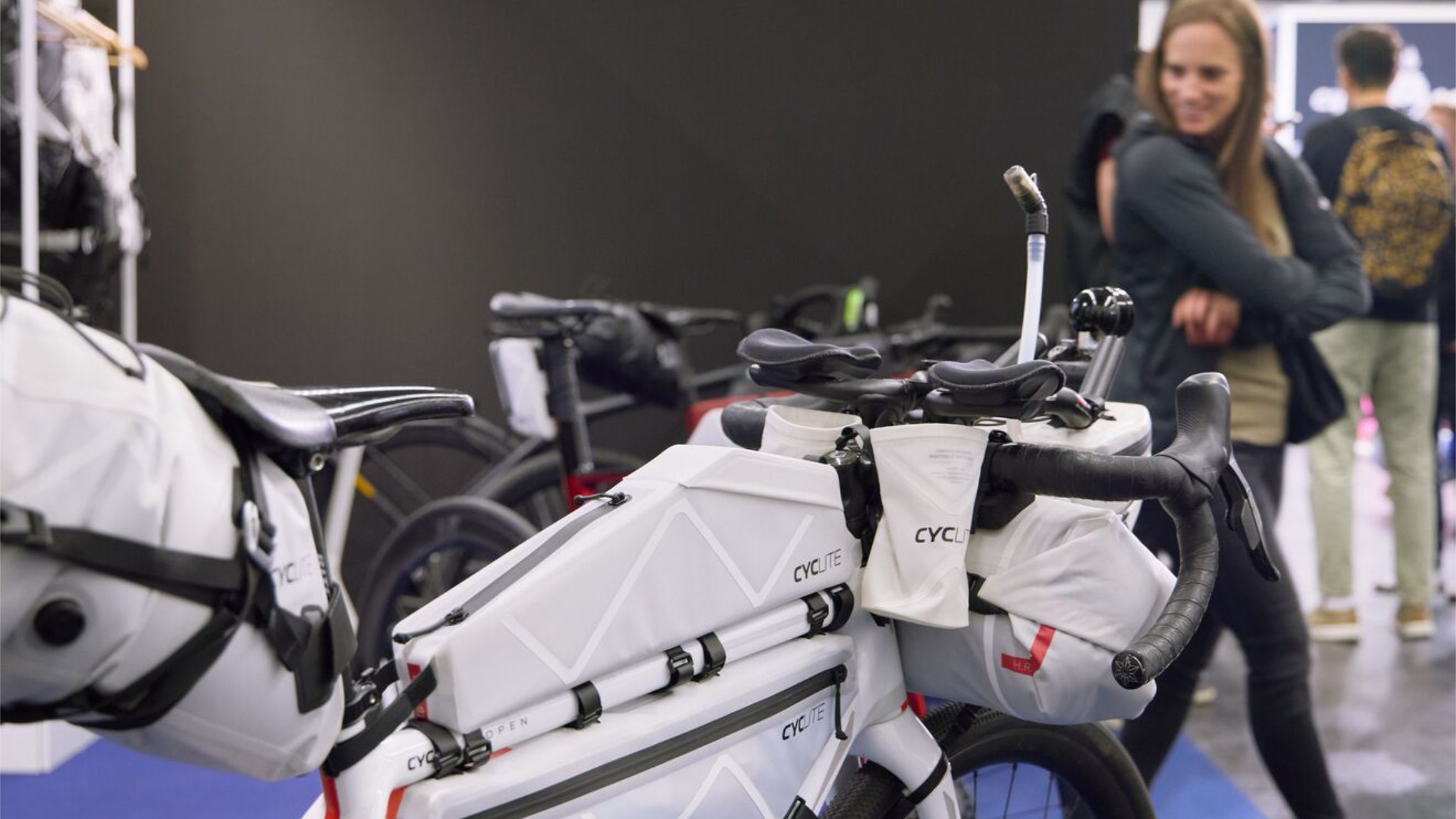 Woman standing next to a bicycle