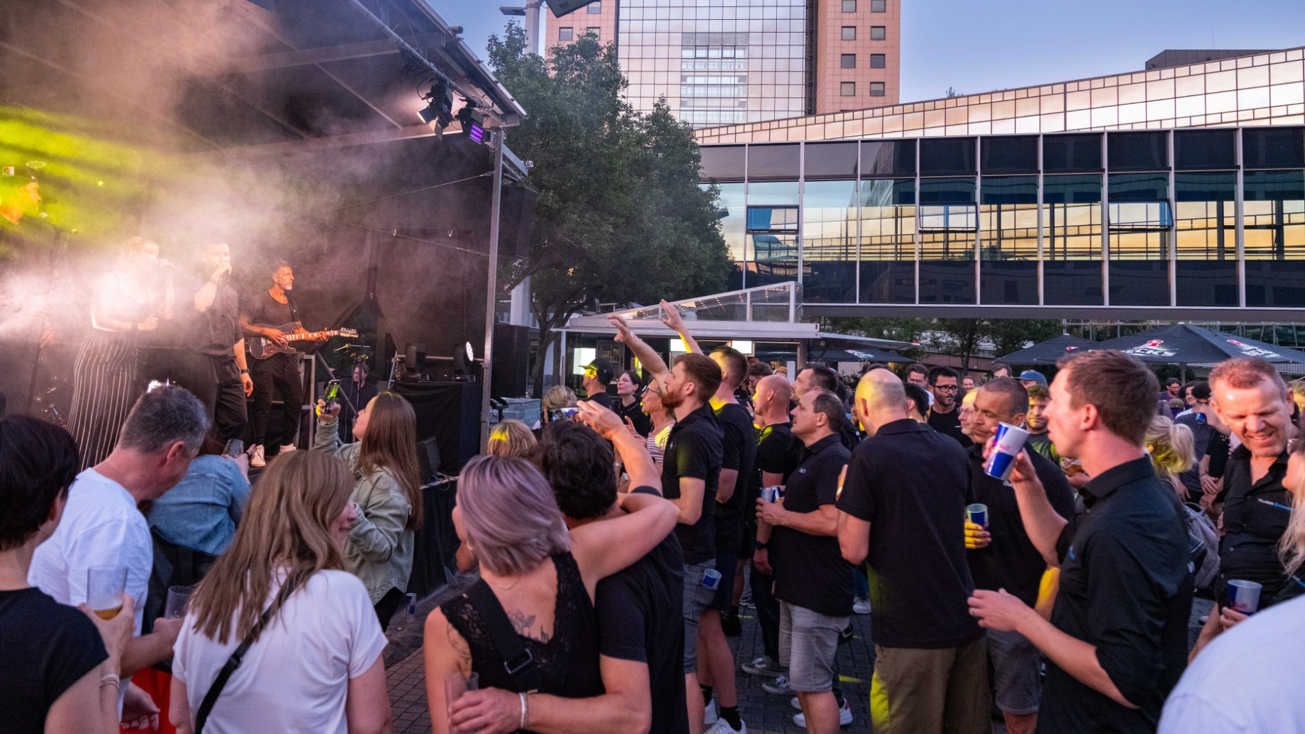 Visitors celebrate at outdoor event at exhibition grounds