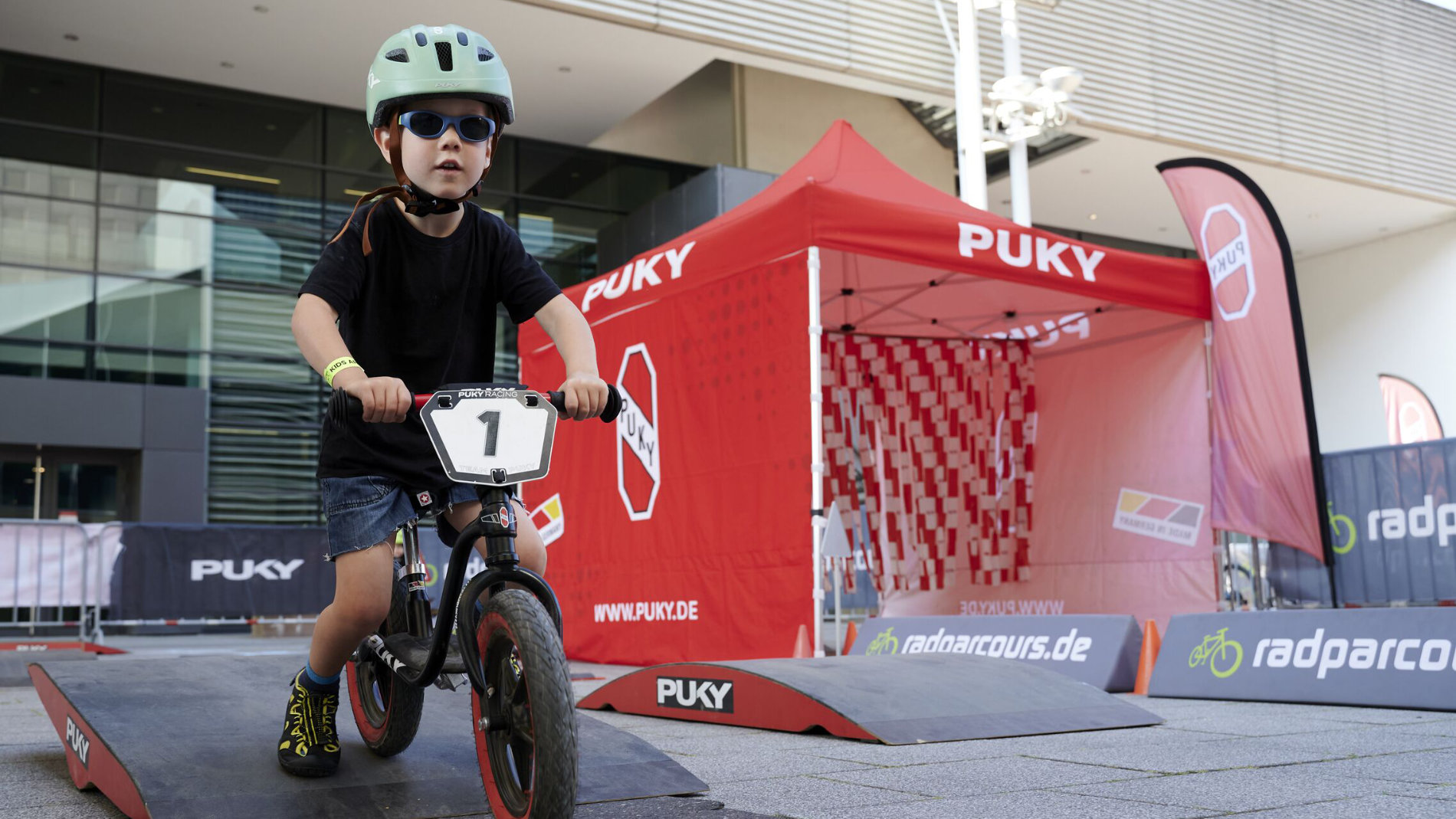 Child tests balance bike on the PUKY course
