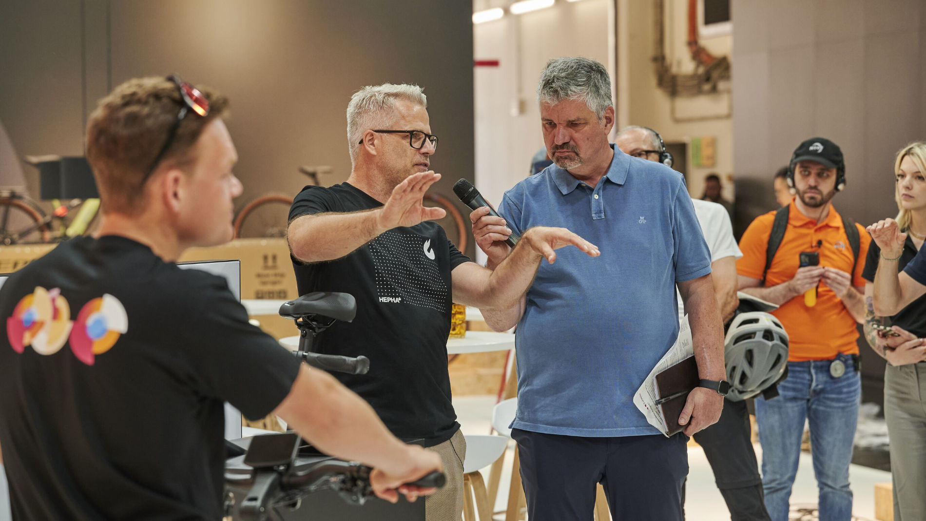 Conversation at the bicycle booth at a trade show