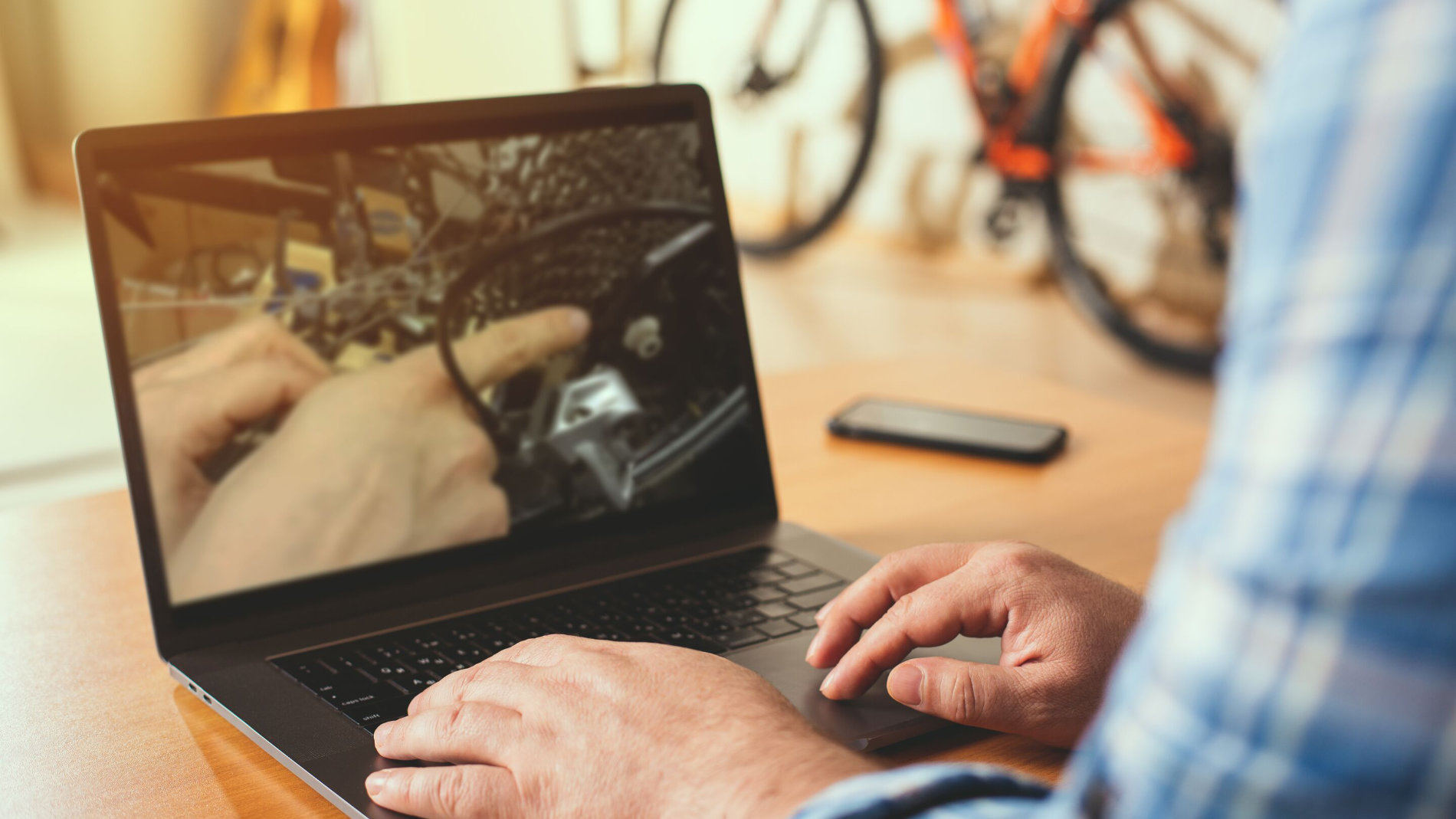 Online bicycle repair tutorial on laptop